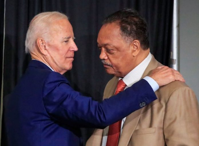 PRESIDENT BIDEN LISTENING TO REV. JACKSON APPEAL FOR MORE COVID-19 DOSES FOR INDIA IN TULSA, OK