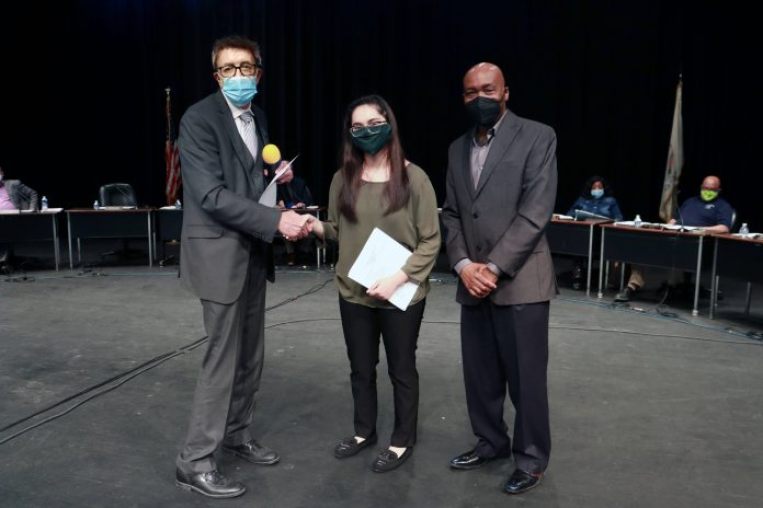 Vice President of Administration, Martin Lareau (left) shakes hand of newly elected Student Trustee, Fatima Serrato (center), alongside Chairman of the Board of Trustees, Terry South Holland Resident Fatima Serrato Sworn in as Student Trustee at South Suburban College